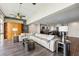Open living area with a large comfortable sectional sofa, wet bar, and access to the modern kitchen at 7200 Sunshine Skyway S Ln # 16G, St Petersburg, FL 33711