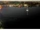 Night view of the bay and a sailboat at 7200 Sunshine Skyway S Ln # 16G, St Petersburg, FL 33711
