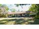 Charming single-story home with well-manicured lawn and mature trees in a peaceful residential setting at 908 N Knight St, Plant City, FL 33563