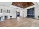 Bright living room features a statement fireplace, hardwood floors and modern finishes at 9514 Snapper Cir, Port Charlotte, FL 33981