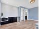 Living space with mini-kitchen featuring white tile and blue walls at 9514 Snapper Cir, Port Charlotte, FL 33981