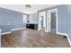 Living space with mini-kitchen and doorway to a bathroom with tiled shower at 9514 Snapper Cir, Port Charlotte, FL 33981