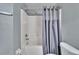 Bathroom with a shower/tub and stylish gray shower curtain at 9526 Newdale Way # 101, Riverview, FL 33578