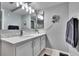 Bathroom features a modern vanity with stone countertops and decorative tiled backsplash at 9526 Newdale Way # 101, Riverview, FL 33578