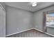 Cozy bedroom with gray carpeting and a large window for ample natural light at 9526 Newdale Way # 101, Riverview, FL 33578