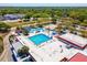 Aerial view of the community pool area, highlighting multiple pools, slides, and surrounding amenities at 9914 Sir Frederick St, Tampa, FL 33637