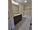 Bathroom features vanity with granite countertops, tiled floors, and tub with tiled walls at 10200 Gandy N Blvd # 235, St Petersburg, FL 33702