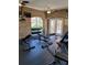 Spacious workout room with brick archways, ceiling fans, and exercise equipment at 10200 Gandy N Blvd # 235, St Petersburg, FL 33702