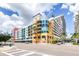 Modern condo building featuring colorful accents, multiple stories, and private balconies at 1120 E Kennedy Blvd # 411, Tampa, FL 33602