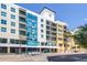 Modern condo building featuring a sleek design with balconies and street-level retail at 1120 E Kennedy Blvd # 411, Tampa, FL 33602