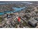 Aerial view of neighborhood, showcasing proximity to beaches and waterfront property at 12404 Sunshine Ln, Treasure Island, FL 33706