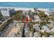 Aerial view of the property, near the beach, denoted by a red arrow at 12404 Sunshine Ln, Treasure Island, FL 33706