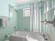 Vintage bathroom with a tiled shower/tub combination and pedestal sink at 12404 Sunshine Ln, Treasure Island, FL 33706