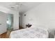 Bedroom featuring bed, side table and access to the bathroom at 12404 Sunshine Ln, Treasure Island, FL 33706