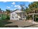 This home features a welcoming front porch and has a carport at 12404 Sunshine Ln, Treasure Island, FL 33706