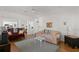 Cozy living room with wood floors, comfortable seating, and natural light at 12404 Sunshine Ln, Treasure Island, FL 33706