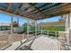 Relaxing covered deck perfect for enjoying the outdoors, featuring outdoor chairs at 12404 Sunshine Ln, Treasure Island, FL 33706