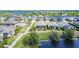 Scenic aerial shot of homes next to a peaceful pond, showcasing the neighborhood's charm and community at 12427 Bay Estuary Bnd, Riverview, FL 33579