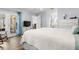 Relaxing bedroom featuring white furniture, light blue walls and access to ensuite at 14 Cypress Dr, Palm Harbor, FL 34684