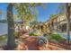 Beautifully landscaped backyard with a patio, lush greenery, and decorative accents with an enclosed pool and patio at 1439 Wetherington Way, Palm Harbor, FL 34683