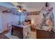 Lovely bedroom with pink walls, wood floors, and charming decor, perfect for a retreat at 1439 Wetherington Way, Palm Harbor, FL 34683