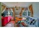 Cozy breakfast nook featuring custom cushioned bench and light-filled windows and red cabinet with coffee station at 1439 Wetherington Way, Palm Harbor, FL 34683