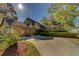 Charming home featuring a spacious driveway, a two-car garage, and a beautifully landscaped front yard at 1439 Wetherington Way, Palm Harbor, FL 34683