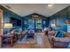Inviting living room with fireplace, wood floors, and comfortable leather seating at 1439 Wetherington Way, Palm Harbor, FL 34683