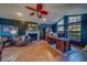 Cozy living room with fireplace, wood floors, and elegant furnishings at 1439 Wetherington Way, Palm Harbor, FL 34683