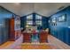 Home office with plaid walls, ample natural light, and built-in shelving at 1439 Wetherington Way, Palm Harbor, FL 34683