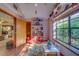 Inviting playroom featuring playful decor, natural light and built in shelving with toys and study area at 1439 Wetherington Way, Palm Harbor, FL 34683
