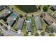 Aerial view of homes with pools in a lakeside neighborhood at 15616 Greyrock Dr, Spring Hill, FL 34610