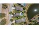 Aerial view of homes with in-ground pools in a lakeside neighborhood at 15616 Greyrock Dr, Spring Hill, FL 34610