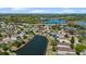 An aerial view overlooking the property and the serene pond at 15616 Greyrock Dr, Spring Hill, FL 34610