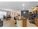 Open-concept kitchen and dining area featuring stainless steel appliances and tile floors at 15616 Greyrock Dr, Spring Hill, FL 34610