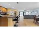 Open-concept kitchen features a breakfast bar, stainless steel appliances, and an open layout at 15616 Greyrock Dr, Spring Hill, FL 34610