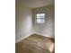 Cozy bedroom with light-colored wood flooring, offering a clean and bright space at 1606 Marilyn Ave, Bradenton, FL 34207