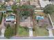 Aerial view of property featuring a well-maintained lawn and mature trees, outlined in red at 1617 Cherokee Trl, Valrico, FL 33594