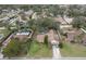 Bird's eye view of a single-Gathering home with manicured lawn and mature landscaping in the neighborhood at 1617 Cherokee Trl, Valrico, FL 33594