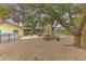 Large backyard with an above ground pool, a seating area, and mature trees, ideal for outdoor enjoyment at 1617 Cherokee Trl, Valrico, FL 33594