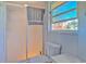 Bright bathroom with a shower, window, and toilet at 1617 Cherokee Trl, Valrico, FL 33594