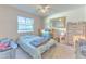 Bedroom with carpet, a window, and a gold framed mirror at 1617 Cherokee Trl, Valrico, FL 33594