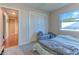 Bedroom with carpet, a window, and closet at 1617 Cherokee Trl, Valrico, FL 33594