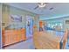 Bright dining room with wood furniture and view to living room and kitchen at 1617 Cherokee Trl, Valrico, FL 33594