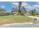 Well-maintained home with a manicured lawn, mature trees, and a spacious driveway at 1617 Cherokee Trl, Valrico, FL 33594
