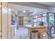 Well-lit kitchen with white tile floors, ample cabinet space, and a functional layout, ideal for cooking and meal preparation at 1617 Cherokee Trl, Valrico, FL 33594