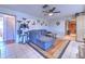 Comfortable living room with tile floors, a sectional sofa, and a cozy atmosphere, ideal for relaxing and entertaining at 1617 Cherokee Trl, Valrico, FL 33594