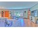 Bright living room with hardwood floors, a large window, and neutral colors creates a comfortable and welcoming atmosphere at 1617 Cherokee Trl, Valrico, FL 33594