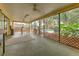 Spacious enclosed patio area with a view of the backyard, perfect for outdoor enjoyment at 1617 Cherokee Trl, Valrico, FL 33594
