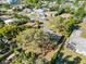 Aerial view of home showcasing its lot, mature trees, and neighborhood setting at 1653 S Prescott Ave, Clearwater, FL 33756